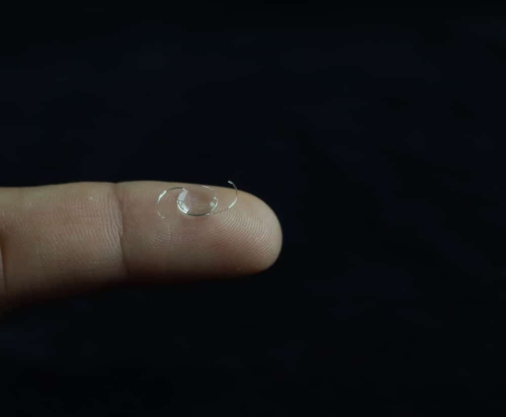 Intraocular lens implant resting on a finger